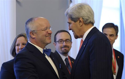 U.S. Secretary of State John Kerry (R) is greeted by Lithuanian Minister of National Defense Juozas Olekas at the Presidential Palace in Vil U.S. Secretary of State John Kerry (R) is greeted by Lithuanian Minister of National Defense Juozas Olekas at the Presidential Palace in Vil
