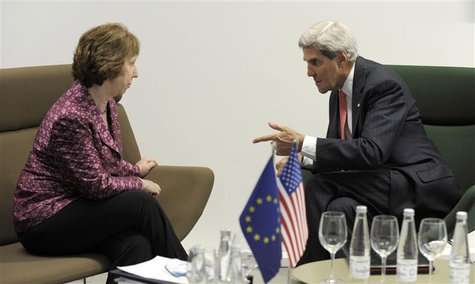 U.S. Secretary of State John Kerry (R) meets with European Union High Representative Catherine Ashton before a meeting of EU ministers of fo U.S. Secretary of State John Kerry (R) meets with European Union High Representative Catherine Ashton before a meeting of EU ministers of fo