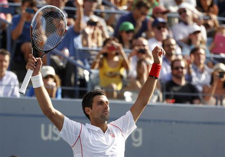 Novak Djokovic of Serbia celebrates after defeating Stanislas Wawrinka of Switzerland during their men's semi-final match at the U.S. Open t Novak Djokovic of Serbia celebrates after defeating Stanislas Wawrinka of Switzerland during their men's semi-final match at the U.S. Open t