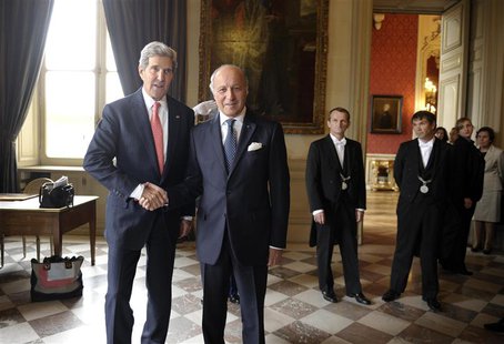 U.S. Secretary of State John Kerry (L) arrives for a meeting with French Foreign Affairs Minister Laurent Fabius (2nd L) at the Ministry of U.S. Secretary of State John Kerry (L) arrives for a meeting with French Foreign Affairs Minister Laurent Fabius (2nd L) at the Ministry of