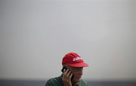 Former Formula One champion Niki Lauda of Austria talks on his phone during the third practice session of the Italian F1 Grand Prix at the M Former Formula One champion Niki Lauda of Austria talks on his phone during the third practice session of the Italian F1 Grand Prix at the M