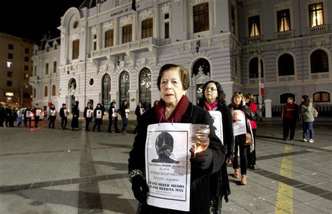 Relatives of victims tortured and executed during the rule of General Augusto Pinochet, take part in a rally marking the 1973 military coup Relatives of victims tortured and executed during the rule of General Augusto Pinochet, take part in a rally marking the 1973 military coup
