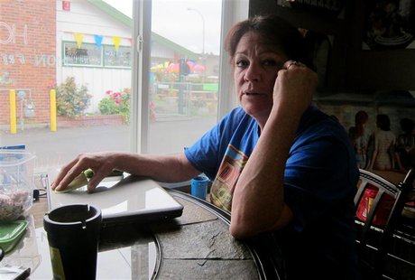Jean Wood sits in the Butt's Tobacco store that she owns with her husband Larry in a strip mall south of Seattle, July 24, 2013. REUTERS/And Jean Wood sits in the Butt's Tobacco store that she owns with her husband Larry in a strip mall south of Seattle, July 24, 2013. REUTERS/And