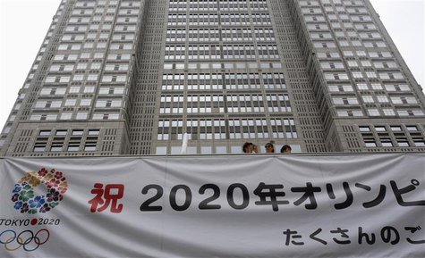 A huge banner reading "Celebration 2020 Olympics" is set up at Tokyo Metropolitan Government Building in Tokyo September 8, 2013. REUTERS/Yu A huge banner reading "Celebration 2020 Olympics" is set up at Tokyo Metropolitan Government Building in Tokyo September 8, 2013. REUTERS/Yu