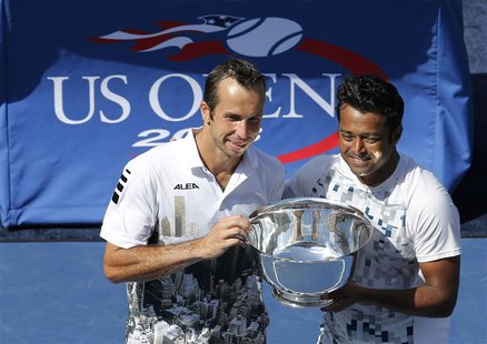Leander Paes of India (R) and playing partner Radek Stepanek of the Czech Republic pose with their trophy after they defeated Alexander Peya Leander Paes of India (R) and playing partner Radek Stepanek of the Czech Republic pose with their trophy after they defeated Alexander Peya