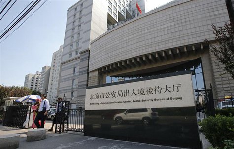 Foreigners walk out from Beijing's Exit & Entry Administration Service Center, September 7, 2013. Foreign executives in China are upset at a Foreigners walk out from Beijing's Exit & Entry Administration Service Center, September 7, 2013. Foreign executives in China are upset at a