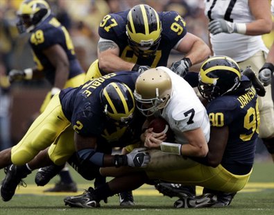 QB Jimmy Clausen gets sacked during the epic 2007 battle between the Fighting Irish and the Wolverines. (Photo : Reuters) QB Jimmy Clausen gets sacked during the epic 2007 battle between the Fighting Irish and the Wolverines. (Photo : Reuters)
