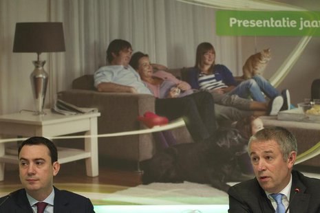 KPN's Chief Executive Officer Eelco Blok (R) and Chief Financial Officer Eric Hageman speak after the presentation of the 2011 fourth quarte KPN's Chief Executive Officer Eelco Blok (R) and Chief Financial Officer Eric Hageman speak after the presentation of the 2011 fourth quarte