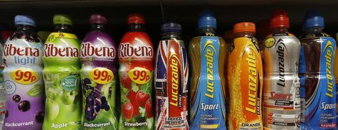 Lucozade and Ribena drinks bottles are displayed on a shelf in a shop in London April 24, 2013. REUTERS/Suzanne Plunkett Lucozade and Ribena drinks bottles are displayed on a shelf in a shop in London April 24, 2013. REUTERS/Suzanne Plunkett