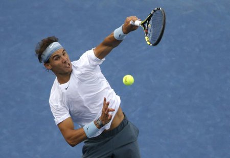 Rafael Nadal of Spain hits a smash to Richard Gasquet of France during their men's semi-final match at the U.S. Open tennis championships in Rafael Nadal of Spain hits a smash to Richard Gasquet of France during their men's semi-final match at the U.S. Open tennis championships in