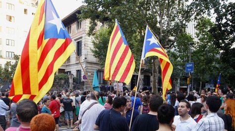 Protesters with Catalan Independentist flags demand the resignation of Spanish Prime Minister Mariano Rajoy, outside the Spanish Government Protesters with Catalan Independentist flags demand the resignation of Spanish Prime Minister Mariano Rajoy, outside the Spanish Government