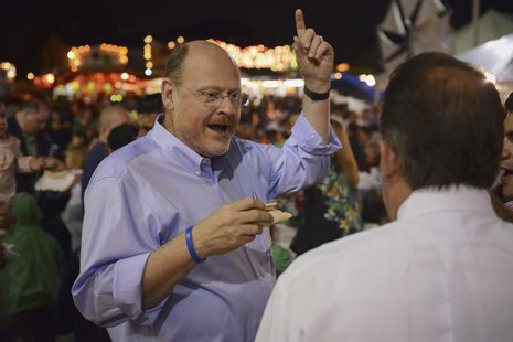 New York City mayoral candidate Joe Lhota (L) speaks to people attending the Greek Festival while campaigning in the Staten Island borough o New York City mayoral candidate Joe Lhota (L) speaks to people attending the Greek Festival while campaigning in the Staten Island borough o