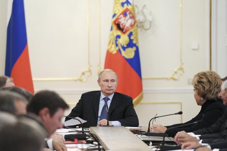 Russian President Vladimir Putin (C) chairs a meeting with members of the Security Council at the Novo-Ogaryovo residence outside Moscow, Se Russian President Vladimir Putin (C) chairs a meeting with members of the Security Council at the Novo-Ogaryovo residence outside Moscow, Se