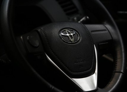 The logo of Toyota Motor Corp. is seen on a steering wheel of the company's car at the Toyota Motor's showroom in Tokyo August 1, 2013. REUT The logo of Toyota Motor Corp. is seen on a steering wheel of the company's car at the Toyota Motor's showroom in Tokyo August 1, 2013. REUT
