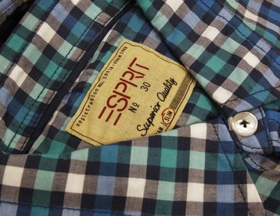 A shirt made by Esprit is displayed at one of its outlets in Hong Kong August 7, 2012. REUTERS/Bobby Yip A shirt made by Esprit is displayed at one of its outlets in Hong Kong August 7, 2012. REUTERS/Bobby Yip
