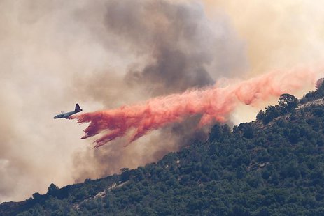 A plane drops fire retardant on the Morgan fire burning atop Mount Diablo as seen from Clayton, California September 9, 2013. REUTERS/Noah B A plane drops fire retardant on the Morgan fire burning atop Mount Diablo as seen from Clayton, California September 9, 2013. REUTERS/Noah B
