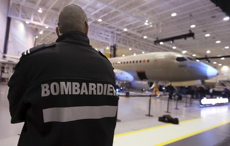 A security guard looks on as Bombardier unveiled its CSeries aircraft at a news conference at its assembly facility in Mirabel, Quebec, Marc A security guard looks on as Bombardier unveiled its CSeries aircraft at a news conference at its assembly facility in Mirabel, Quebec, Marc