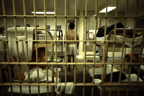 An inmate stands in his cell at the Orange County jail in Santa Ana, California, May 24, 2011. REUTERS/Lucy Nicholson An inmate stands in his cell at the Orange County jail in Santa Ana, California, May 24, 2011. REUTERS/Lucy Nicholson
