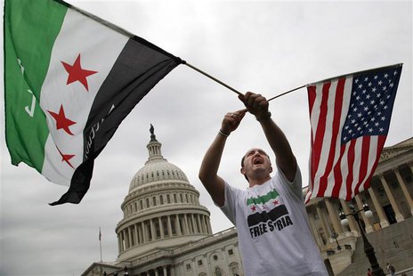 Jehad Sibai, a physician from Michigan, joins a group of Syrian-Americans rallying in favor of proposed U.S. military action, outside the U. Jehad Sibai, a physician from Michigan, joins a group of Syrian-Americans rallying in favor of proposed U.S. military action, outside the U.
