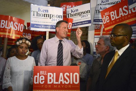 New York mayoral candidate Bill de Blasio, standing between his daughter Chiara (L) and district attorney candidate Ken Thompson (R), speaks New York mayoral candidate Bill de Blasio, standing between his daughter Chiara (L) and district attorney candidate Ken Thompson (R), speaks
