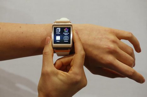 A model presents a Samsung Galaxy Gear smartwatch after its launch at the IFA consumer electronics fair in Berlin, September 4, 2013. REUTER A model presents a Samsung Galaxy Gear smartwatch after its launch at the IFA consumer electronics fair in Berlin, September 4, 2013. REUTER