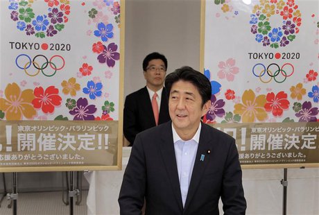 Japan's Prime Minister Shinzo Abe smiles as he reports to his cabinet members Tokyo's successful bid to host the 2020 Summer Olympics and Pa Japan's Prime Minister Shinzo Abe smiles as he reports to his cabinet members Tokyo's successful bid to host the 2020 Summer Olympics and Pa