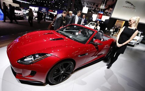 A model stands next to a Jaguar F Type S convertible model, winner of the 2013 World Car Awards World Car Design of the Year during a press A model stands next to a Jaguar F Type S convertible model, winner of the 2013 World Car Awards World Car Design of the Year during a press