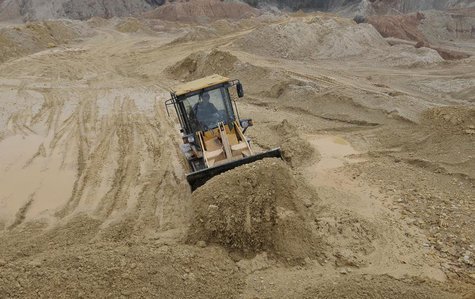 A labourer operates a bulldozer at a site of a rare earth metals mine at Nancheng county, Jiangxi province March 14, 2012. REUTERS/Stringer A labourer operates a bulldozer at a site of a rare earth metals mine at Nancheng county, Jiangxi province March 14, 2012. REUTERS/Stringer