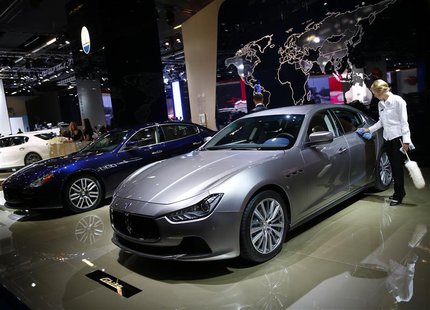 A Maserati Ghibli car is polished by a worker during a media preview day at the Frankfurt Motor Show (IAA) September 10, 2013. REUTERS/Kai P A Maserati Ghibli car is polished by a worker during a media preview day at the Frankfurt Motor Show (IAA) September 10, 2013. REUTERS/Kai P
