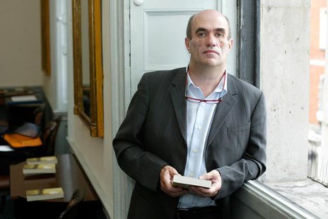 Irish author Colm Toibin poses for photographers after he won the world's richest literary prize for a single work of fiction in English on Irish author Colm Toibin poses for photographers after he won the world's richest literary prize for a single work of fiction in English on