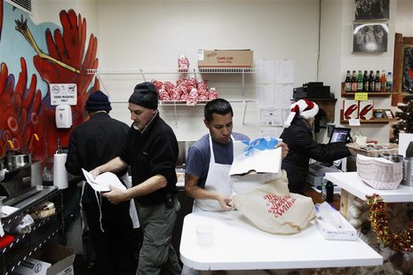 Small-business owners Ralph Gorham (2nd L) and Susan Povich (R) work with their employees to sell lobster rolls at their shop "Redhook Lobst Small-business owners Ralph Gorham (2nd L) and Susan Povich (R) work with their employees to sell lobster rolls at their shop "Redhook Lobst