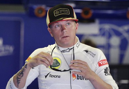 Lotus F1 Formula One driver Kimi Raikkonen of Finland holds his sunglasses during the third practice session of the Italian F1 Grand Prix at Lotus F1 Formula One driver Kimi Raikkonen of Finland holds his sunglasses during the third practice session of the Italian F1 Grand Prix at