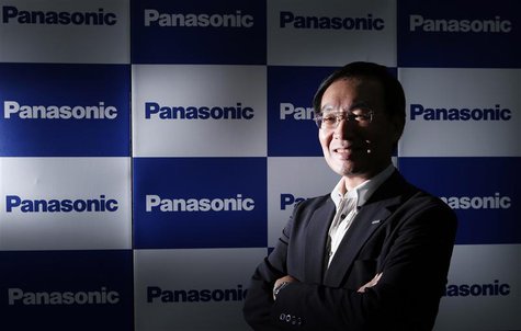 Panasonic Corp's President Kazuhiro Tsuga poses in front of company logos after an interview with Reuters in Tokyo September 4, 2013. REUTER Panasonic Corp's President Kazuhiro Tsuga poses in front of company logos after an interview with Reuters in Tokyo September 4, 2013. REUTER