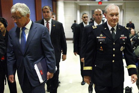 U.S. Defense Secretary Chuck Hagel (L) and Chairman of the Joint Chiefs of Staff U.S. Army General Martin Dempsey (R) arrive to brief member U.S. Defense Secretary Chuck Hagel (L) and Chairman of the Joint Chiefs of Staff U.S. Army General Martin Dempsey (R) arrive to brief member