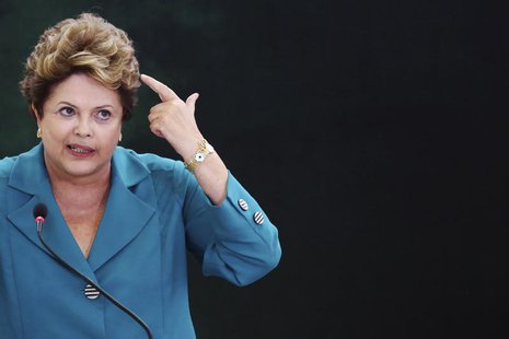 Brazil's President Dilma Rousseff speaks during a ceremony where she signs into law, the bill that allocates the country's oil royalties to Brazil's President Dilma Rousseff speaks during a ceremony where she signs into law, the bill that allocates the country's oil royalties to