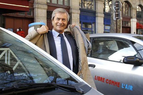Vincent Bollore, CEO of investment group Bollore, stands by Autolib' electric cars during the inauguration of the the Autolib' service in Pa Vincent Bollore, CEO of investment group Bollore, stands by Autolib' electric cars during the inauguration of the the Autolib' service in Pa