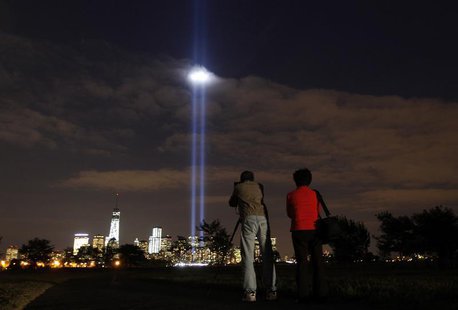The annual Tribute in Light is tested in New York's Lower Manhattan as a man takes a picture at Liberty State Park in Jersey City, New Jerse The annual Tribute in Light is tested in New York's Lower Manhattan as a man takes a picture at Liberty State Park in Jersey City, New Jerse