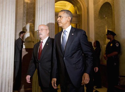 U.S. President Barack Obama walks between meetings on Syria with U.S. Senate Republicans and Democrats, on Capitol Hill in Washington, Septe U.S. President Barack Obama walks between meetings on Syria with U.S. Senate Republicans and Democrats, on Capitol Hill in Washington, Septe