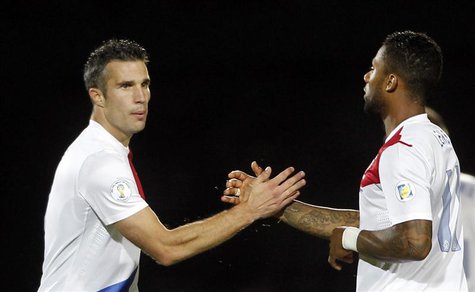Netherlands' Robin Van Persie (L) celebrates with teammate Jeremain Lens after scoring a goal against Andorra during their 2014 World Cup qu Netherlands' Robin Van Persie (L) celebrates with teammate Jeremain Lens after scoring a goal against Andorra during their 2014 World Cup qu