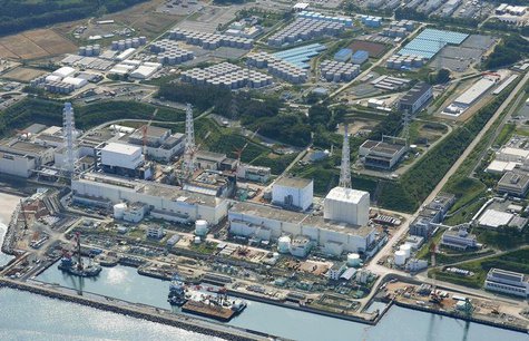 An aerial view shows the Tokyo Electric Power Co.'s (TEPCO) tsunami-crippled Fukushima Daiichi nuclear power plant and its contaminated wate An aerial view shows the Tokyo Electric Power Co.'s (TEPCO) tsunami-crippled Fukushima Daiichi nuclear power plant and its contaminated wate
