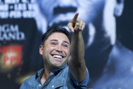 Oscar De La Hoya points towards the crowd before an official weigh-in for WBC welterweight champion Floyd Mayweather Jr. and Robert Guerrero Oscar De La Hoya points towards the crowd before an official weigh-in for WBC welterweight champion Floyd Mayweather Jr. and Robert Guerrero