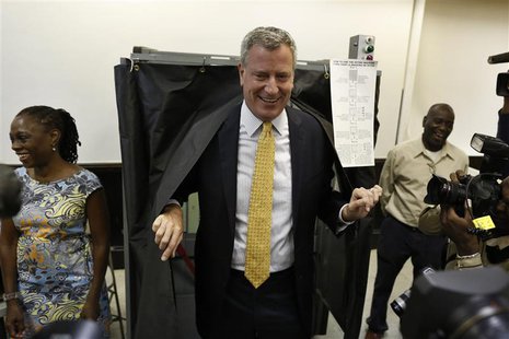 New York City democratic mayoral candidate Bill de Blasio exits a voting booth in the Brooklyn borough of New York after voting in the democ New York City democratic mayoral candidate Bill de Blasio exits a voting booth in the Brooklyn borough of New York after voting in the democ
