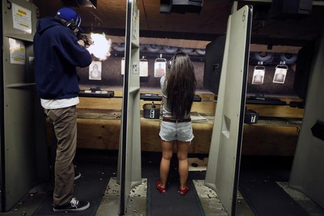People fire at targets at the Los Angeles gun club in Los Angeles, January 23, 2013. REUTERS/Lucy Nicholson People fire at targets at the Los Angeles gun club in Los Angeles, January 23, 2013. REUTERS/Lucy Nicholson