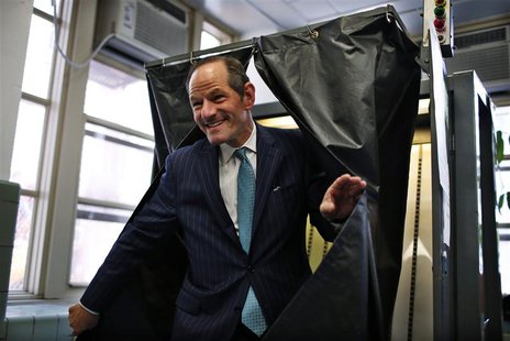 Former New York State Governor and current Democratic candidate for New York City Controller Eliot Spitzer emerges from a voting booth after Former New York State Governor and current Democratic candidate for New York City Controller Eliot Spitzer emerges from a voting booth after
