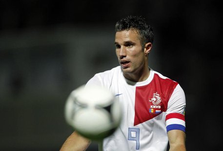 Netherlands's player Robin van Persie gestures during their World Cup qualifying round soccer match against Andorra at Estadi Comunal in And Netherlands's player Robin van Persie gestures during their World Cup qualifying round soccer match against Andorra at Estadi Comunal in And