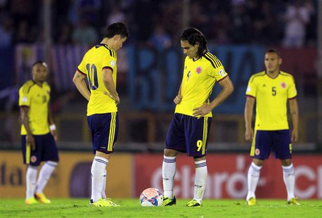 Colombia's players restart the game after conceding a goal to Uruguay's during their 2014 World Cup qualifying soccer match in Montevideo, S Colombia's players restart the game after conceding a goal to Uruguay's during their 2014 World Cup qualifying soccer match in Montevideo, S
