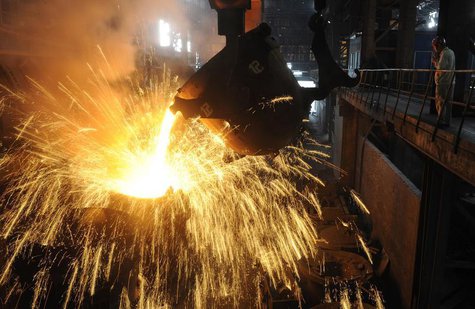 An employee monitors molten iron being poured into a container at a steel plant in Hefei, Anhui province September 9, 2013. REUTERS/Stringer An employee monitors molten iron being poured into a container at a steel plant in Hefei, Anhui province September 9, 2013. REUTERS/Stringer
