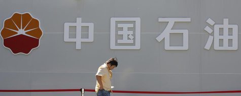 A man walks past a PetroChina company logo at its gas station in Beijing August 29, 2013. REUTERS/Kim Kyung-Hoon A man walks past a PetroChina company logo at its gas station in Beijing August 29, 2013. REUTERS/Kim Kyung-Hoon