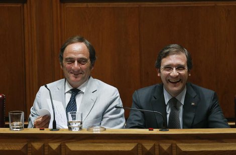 Portugal's Prime Minister Pedro Passos Coelho (R) and Deputy Prime Minister Paulo Portas smile during the debate to vote on a motion of conf Portugal's Prime Minister Pedro Passos Coelho (R) and Deputy Prime Minister Paulo Portas smile during the debate to vote on a motion of conf