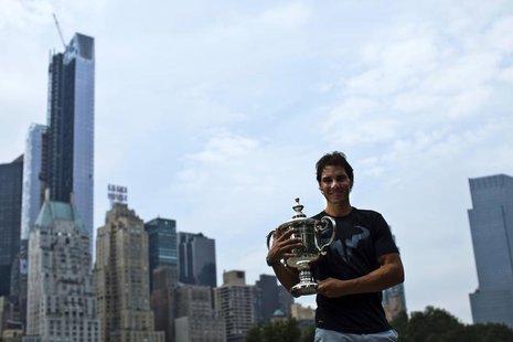 Rafael Nadal of Spain poses with his trophy after winning the men's singles final match against Novak Djokovic of Serbia at the U.S. Open te Rafael Nadal of Spain poses with his trophy after winning the men's singles final match against Novak Djokovic of Serbia at the U.S. Open te